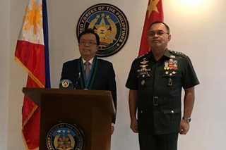 Chinese envoy, AFP chief meet amid tensions over laser incident