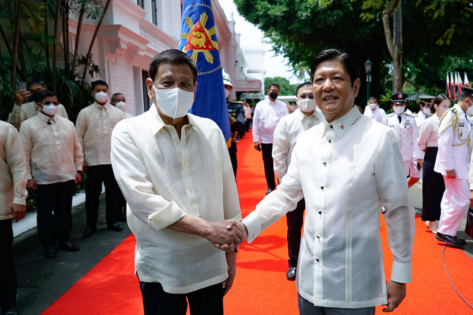 Outgoing President Rodrigo Duterte says goodbye to successor President Ferdinand Marcos, Jr after the departure honors at the Malacanang Palace on June 30, 2022. King Rodriguez, Presidential Photo