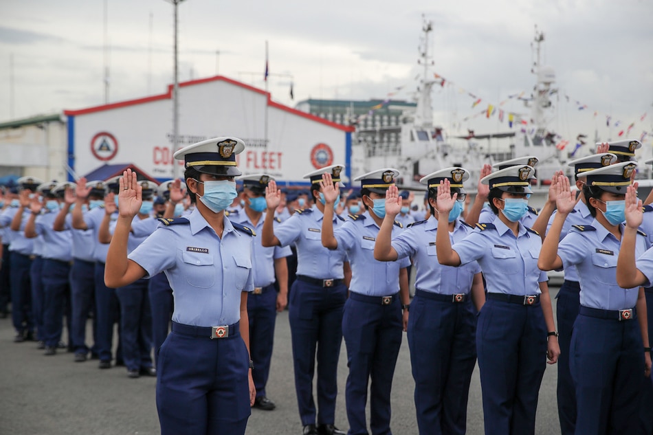 Philippine Coast Guard (PCG) personnel stand at attention during the oath-taking ceremony of PCG trainees at the Coast Guard Fleet Parade Ground, Pier 13, Port Area, Manila on December 5, 2022. Jonathan Cellona, ABS-CBN News