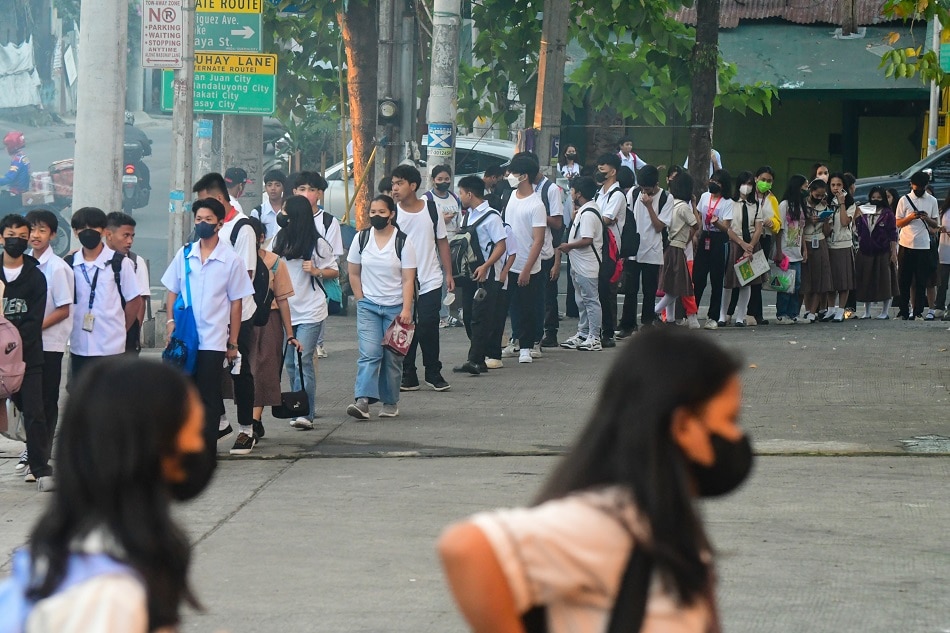 Students line up outside Manuel A. Roxas High School in Quezon City on Feb. 1, 2023. Mark Demayo, ABS-CBN News/File