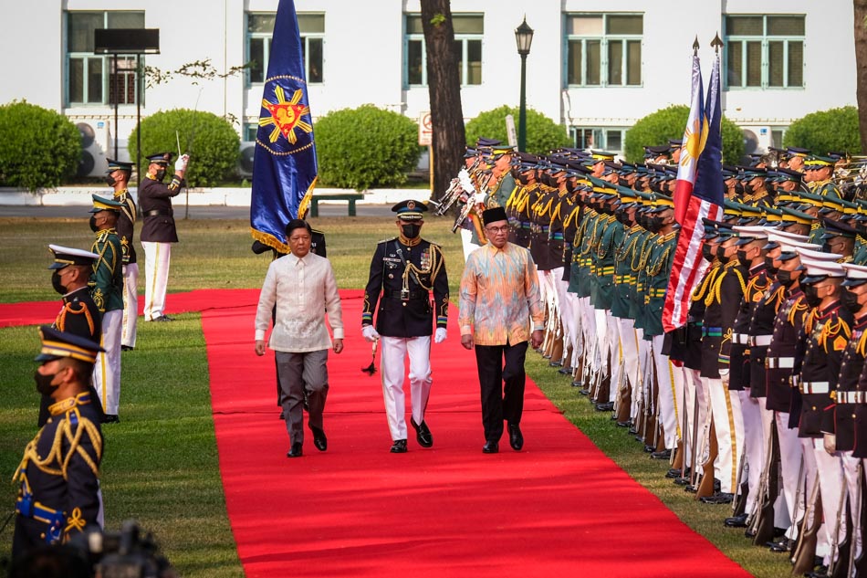 Malaysian Prime Minister Anwar Ibrahim and President Ferdinand Marcos Jr. march during a welcome ceremony at Malacañang Palace on Wednesday. Anwar is the first head of state to go on an official visit to the country under the Marcos administration. Yummie Dingding, PPA Pool