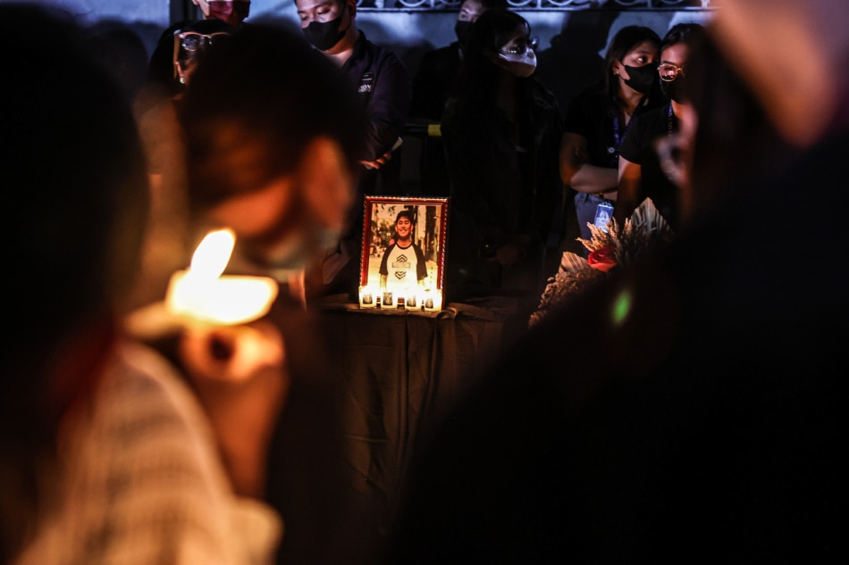 Faculty and students of Adamson University in Manila light candles outside the campus on March 1, 2023 to honor suspected hazing victim John Matthew Salilig. Jire Carreon, ABS-CBN News