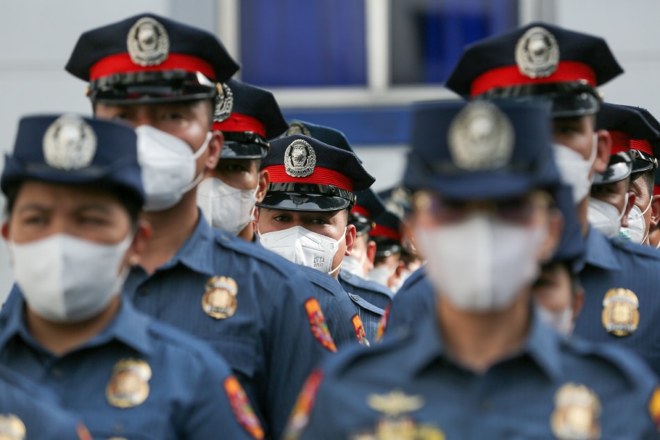 Police officers attend the Simultaneous Oath-Taking and Donning of Ranks of 2nd Level Uniformed Personnel (PCpl-PMAJ) under the CY 2022 Regular Promotion program at the Manila Police District headquarters in Manila on January 10, 2023. Jonathan Cellona, ABS-CBN News