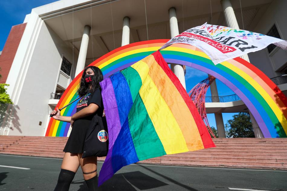 Members of the LGBT community gather inside UP Diliman and carry rainbow flags for the UP Pride March on October 30, 2020. Jonathan Cellona, ABS-CBN News.