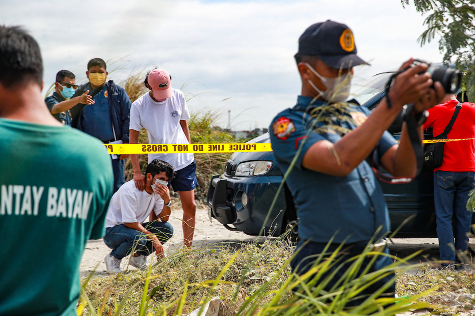 John Martin Salilig, brother of missing 24-year old Adamson University Chemical Engineering student John Matthew Salilig turns emotional after identifying his body pulled from a shallow grave by the Public Information Unit of Cavite Police Provincial Office (PIU Cavite PPO) and Imus City Police Station (Imus CPS) inside the Jade Residences Subdivision in Barangay Malagasang, Imus City on February 28, 2023. Jonathan Cellona, ABS-CBN News