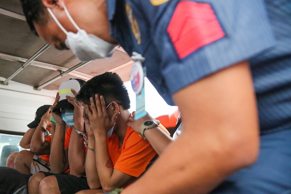 Suspects involved in the death of Adamson University student John Matthew Salilig are escorted by Biñan police after inquest proceedings at the Department of Justice in Padre Faura, Manila on March 2, 2023. Jonathan Cellona, ABS-CBN News