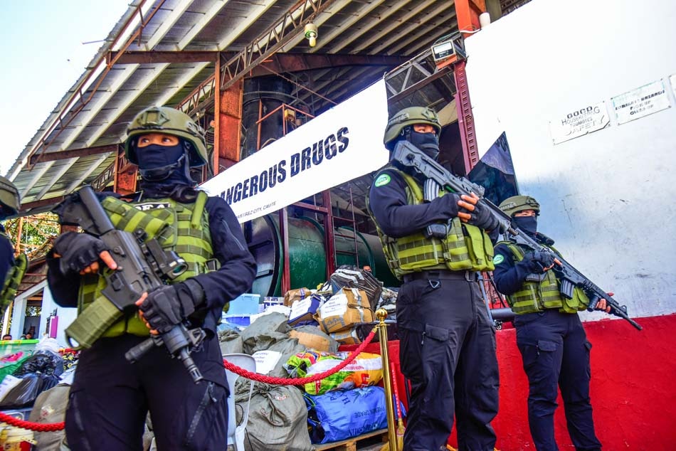 Philippine Drug Enforcement Agency operatives stand on guard during the destruction of confiscated illegal drugs through thermal decomposition in Trece Martires, Cavite on March 16, 2023. Around 3.7 tons of drug stockpile worth P19.9 billion seized from various anti-drug operations were destroyed by PDEA. Maria Tan, ABS-CBN News