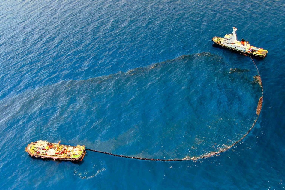 The Philippine Coast Guard deploys an oil spill boom and skimmer with manual scooping around the suspected area of the sunken MT Princess Empress approximately 7.1 nautical miles northeast of the shorelines of Balingawan Port, Lucta Port, and Buloc Bay in Oriental Mindoro on March 14, 2023. The ship was carrying 800,000 liters of industrial fuel oil when it sank near the Verde Island Passage, one of the most biodiverse marine habitats in the planet, on Feb. 28 threatening economic and environmental damage to the area. Photo courtesy of Malayan Towage and Salvage Corporation/Philippine Coast Guard