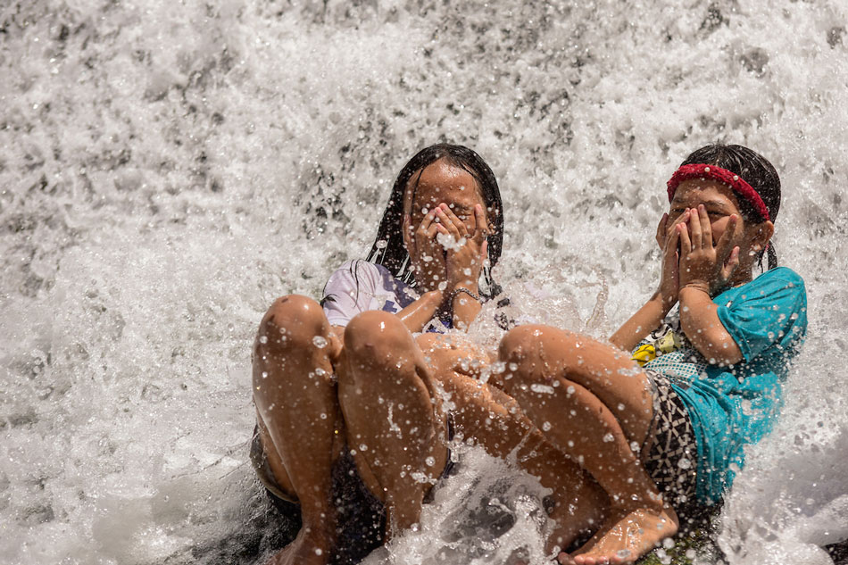 People cool off at the Wawa Dam in Rodriguez, RIzal on March 18, 2023. Maria Tan, ABS-CBN News