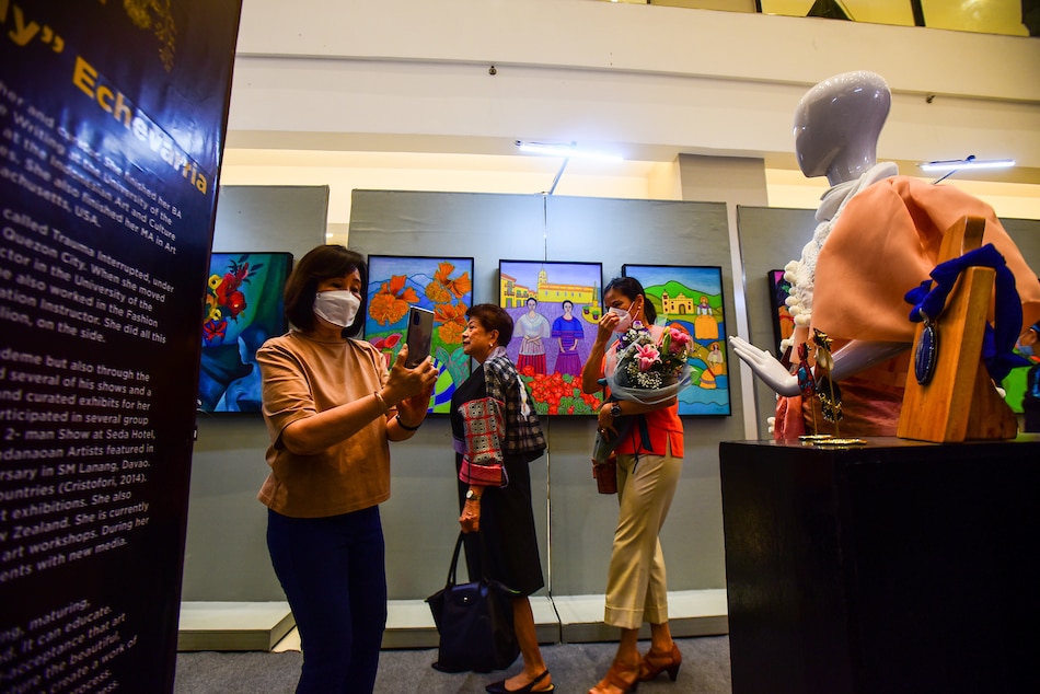 Guests and artists attend the opening of the “Gahum sa Buwak: Flower Power” at the G/F East Wing of Estancia Mall in Pasig City on March 1, 2023. The art event, which is set to run until March 31, 2023, puts the spotlight on female Dabawenyo artists and aims to give them an avenue to showcase their creativity. Maria Tan, ABS-CBN News