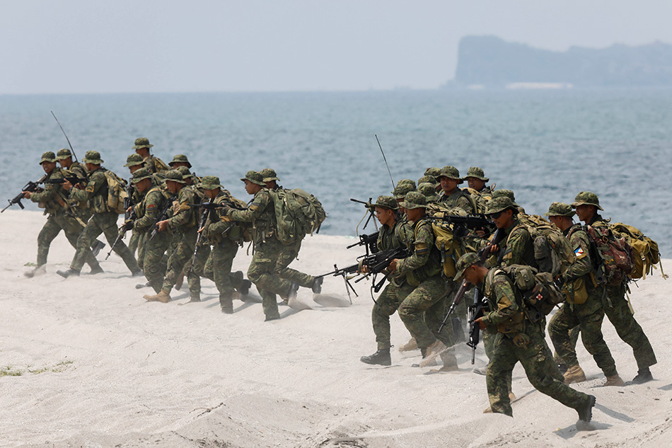 Philippine Marines rush to shore during an amphibious landing exercise with United States counterparts on a beach on the coast of the Naval Education and Training Command in Zambales Province, northwest of Manila, Philippines, 09 May 2018. The Philippines-US Balikatan (Shoulder to Shoulder) Military Exercise is on its 34th iteration, which is aimed to enhance interoperability between security forces of the two countries. EPA-EFE/ROLEX DELA PENA