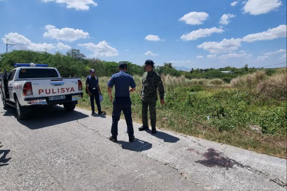 Police survey the crime scene where San Miguel Bulacan Chief of Police LtCol Serna was killed while on hot pursuit operations against suspected robbers in San Ildefonso Bulacan Saturday night. ABS-CBN News.