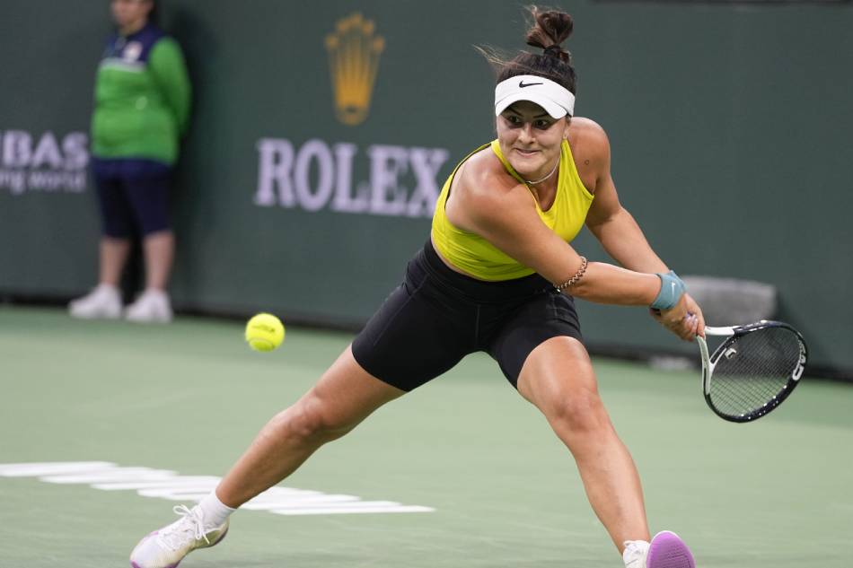 Bianca Andreescu of Canada in action against Iga Swiatek of Poland during the BNP Paribas Open tennis tournament at the Indian Wells Tennis Garden in Indian Wells, California, USA, March 13, 2023. Ray Acevedo, EPA-EFE.