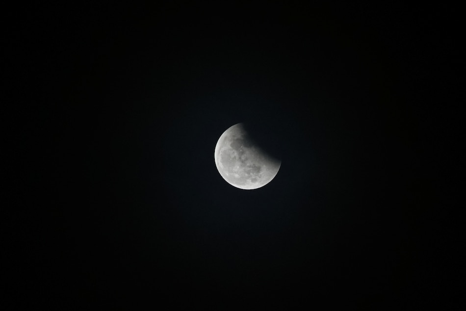 Moon exits partial eclipse in this photo taken in Barangay Kaunlaran, Quezon City on Nov. 8, 2022. Gigie Cruz, ABS-CBN News/File 