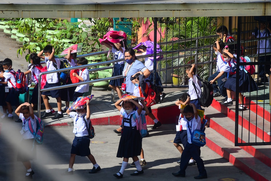 Students of Pres. Corazon Aquino Elementary School in Quezon City leave their classrooms during an earthquake drill on March 9, 2023. Mark Demayo, ABS-CBN News