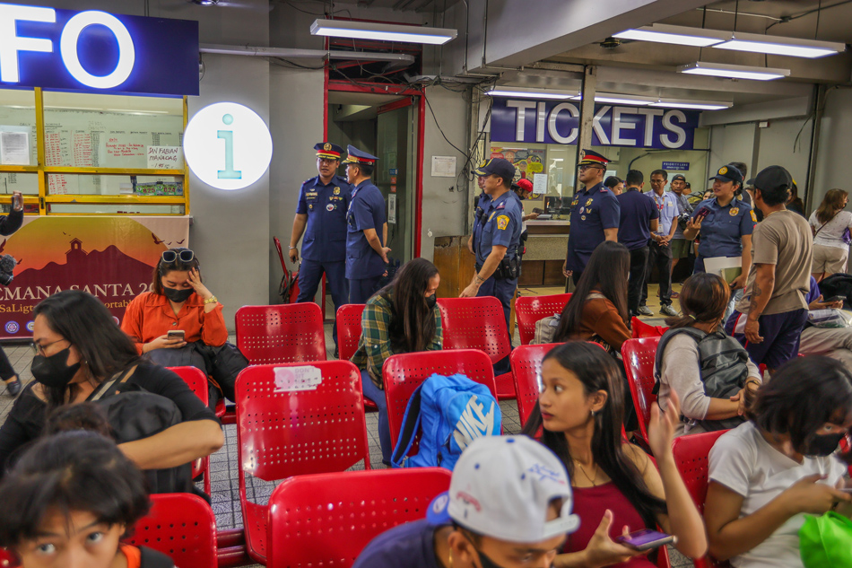  Members of the Philippine National Police led by Regional Director of the National Capital Region Police Major General Edgar Alan O Okubo, conduct an inspection of a provincial bus terminal in Cubao, Quezon City ahead of the start of Holy Week on April 1, 2023. Thousands of Filipinos are expected to flock to the provinces to mark the most sacred week in the liturgical year during the extended holiday. Maria Tan, ABS-CBN News