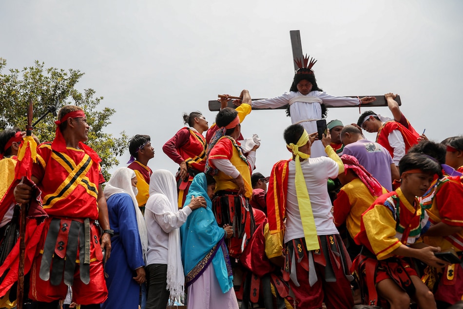 A man portraying Jesus Christ is nailed a wooden cross during a reenactment of Christ's suffering and death on Good Friday in Paombong town, Bulacan province, north of Manila, Philippines on April 7, 2023. Millions of Filipinos are expected to go home to their provinces and join religious gatherings and activities to celebrate the Holy Week. Basilio H. Sepe, ABS-CBN News