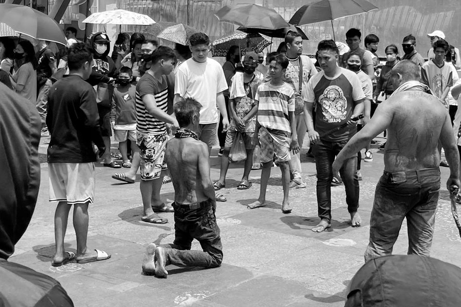 A devotee self-flagellates outside the Quiapo Church on Good Friday. Mike Navallo, ABS-CBN News