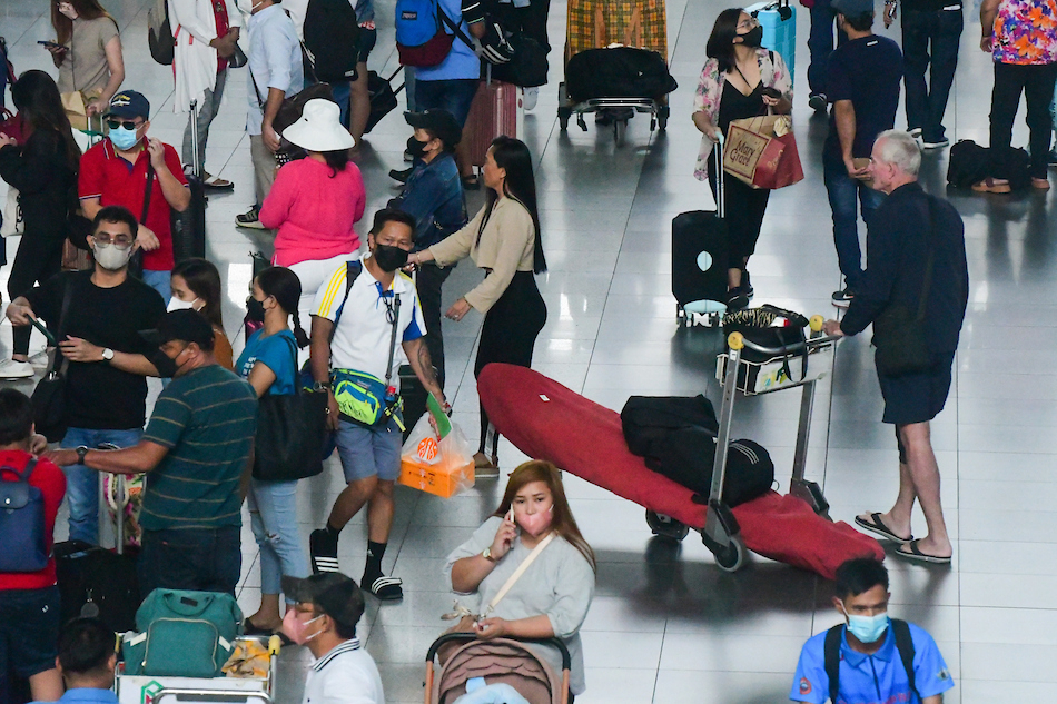 Passengers arrive at the Ninoy Aquino International Terminal 3 in Pasay City on April 5, 2023. More passengers are expected to travel through airports, seaports, and bus terminals on the eve of Maundy Thursday, the start of the long Holy Week break. Mark Demayo, ABS-CBN News