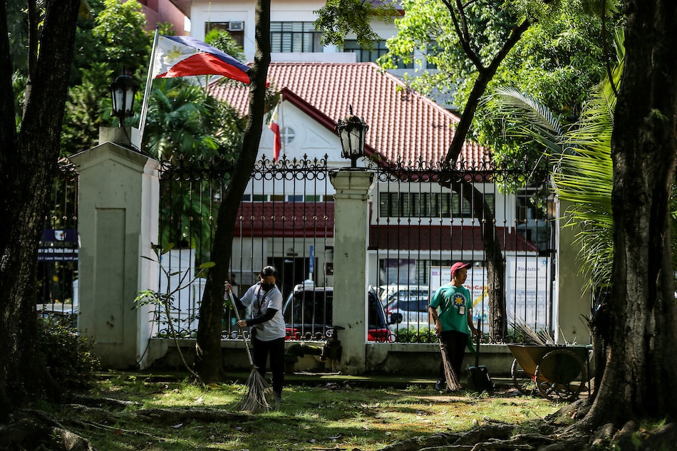 Ground maintenance personnel clear the area near the Malacanang Palace in Manila on October 10, 2022. Jonathan Cellona, ABS-CBN News