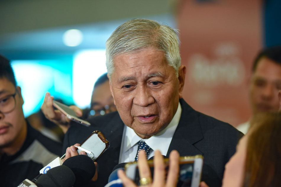 Former DFA Secretary Albert del Rosario answers questions from the media as he arrived at the NAIA Terminal 3 on June 21, 2019. George Calvelo, ABS-CBN News/file