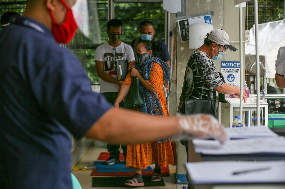 Franchise applicants go through health and sanitation protocols at the Land Transportation and Franchising Regulatory Board (LTFRB) complex in Quezon City on July 20, 2020. Jonathan Cellona, ABS-CBN News. 