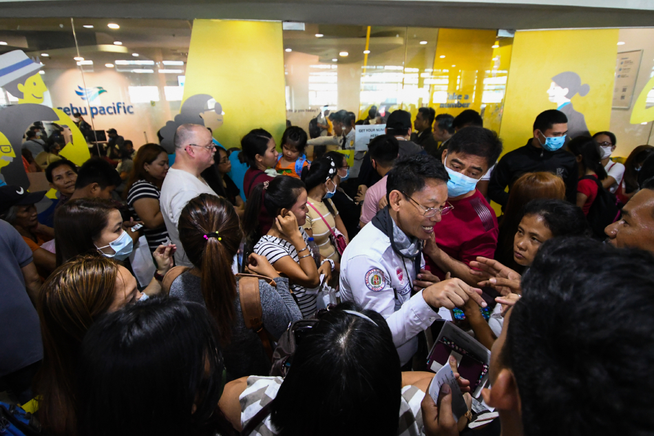 Passengers line up at Cebu Pacific
