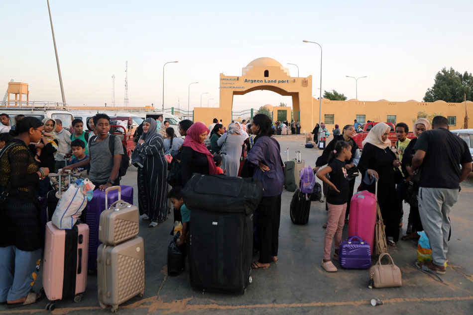 Passengers fleeing from Sudan arrive at the Argeen land port, Egypt, April 27, 2023. Heavy armed clashes between Sudan's military and rival paramilitary groups have occurred in the capital Khartoum and other parts of the country since April 15, 2023. Khaled Elfiqi, EPA-EFE 