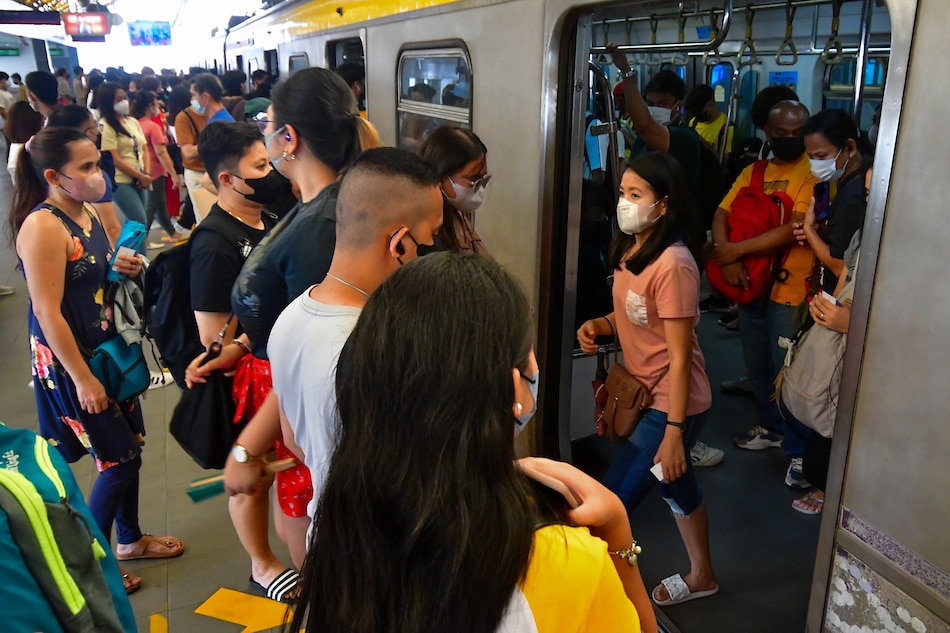 Passengers traveling via the LRT-2 Araneta Center-Cubao station in Quezon City wear face masks on April 25, 2023. Mark Demayo, ABS-CBN News