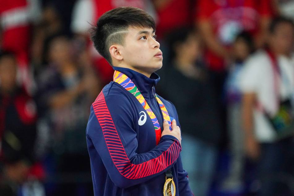 Carlos Yulo of the Philippines sings the national anthem after clinching gold for the artistic apparatus category of the SEA Games men’s artistic gymnastics on November 3, 2019. Czar Dancel, ABS-CBN News/File.