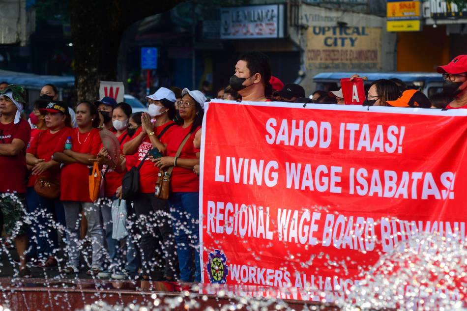 Members of local labor alliances in Marikina City gather at the city's clocktower on Labor Day, May 1, 2023, ahead of the larger protests scheduled in Manila. Multisectoral groups called for living wages, decent working conditions, right to union and freedom of association for Filipino workers, alongside calling out the Marcos Jr. administration for alleged band-aid solutions to labor issues and running from it via a state visit to the United States. Mark Demayo, ABS-CBN News
