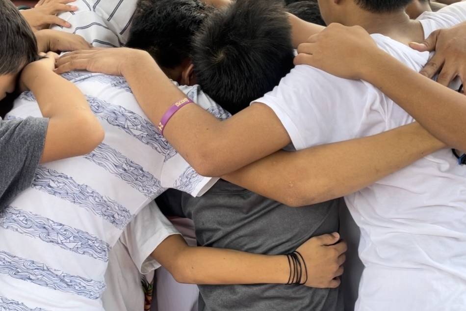 Children huddle in an embrace as their orphanage Gentle Hands is handed a cease and desist order, resulting in social workers taking custody of them. Anna Cerezo, ABS-CBN News