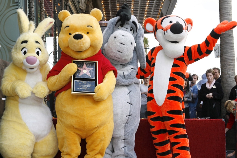 Winnie the Pooh (2nd L) poses for a photo (L-R) Rabbit, Eeyore and Tigger during a ceremony celebrating Pooh's 80th anniversary with a star on the Hollywood Walk of Fame in Los Angeles, April 11, 2006. Pooh, created in the 1920's by British author A.A. Milne, debuted as a cartoon character in the 1966 Disney featurette 'Winnie the Pooh and the Honey Tree,' and went on to star in dozens of films, specials and several cartoon series. Armando Arorizo, EPA/File 