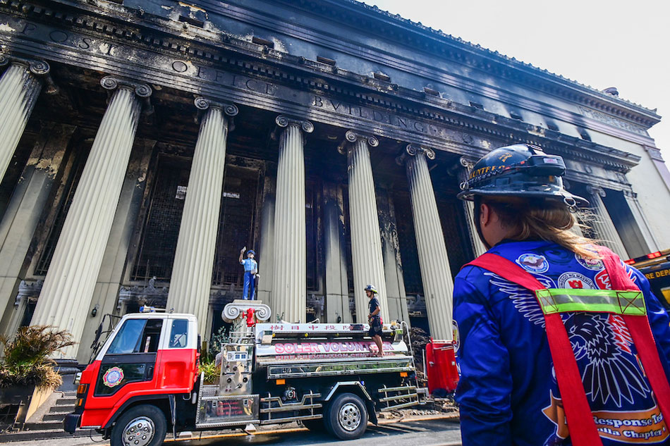 Firefighters inspect the gutted building of Manila Central Post Office in Manila on May 23, 2023. The neo-classical building that was declared an Important Cultural Property was hit by a massive fire, which was raised to general alarm on May 22 and lasted for 30 hours according to BFP. Maria Tan, ABS-CBN News