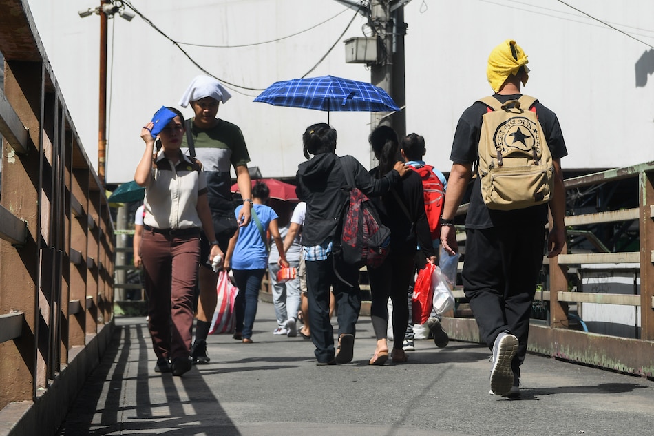 Pedestrians traverse the overpass in North Avenue in Quezon City. Mark Demayo, ABS-CBN News/File