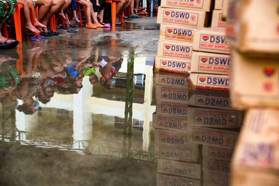 Residents of Bataan Shipping and Engineering Company (BASECO) compound wait for the distribution of Department of Social Welfare and Development (DSWD) relief boxes at the Baseco Compound, Port Area, Manila on June 28, 2022. Jonathan Cellona, ABS-CBN News/file