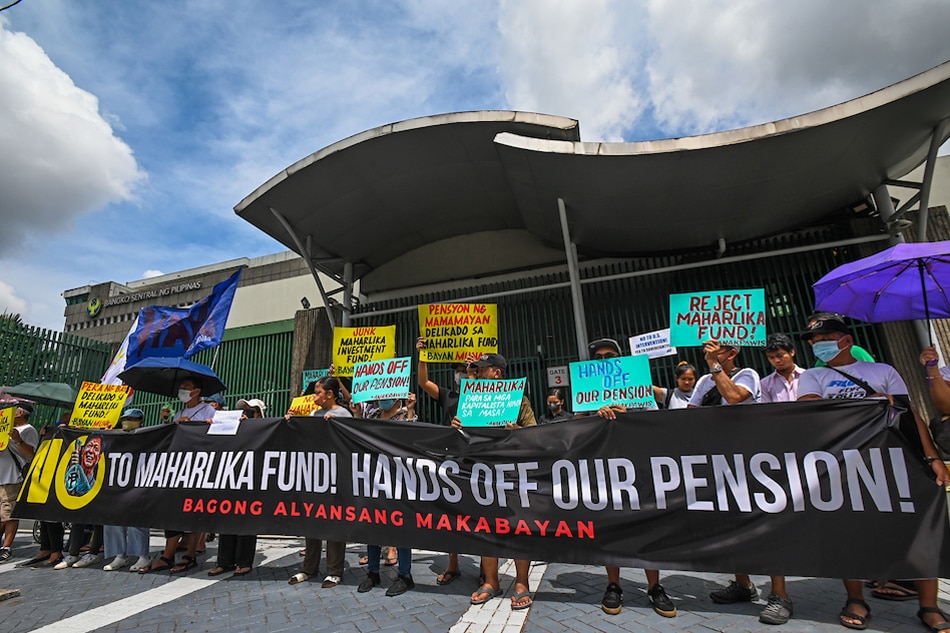  Activists hold a protest against the proposed Maharlika Investment Fund Bill in front of the Bangko Sentral ng Pilipinas headquarters in Quezon City on Wednesday, May 31. Maria Tan, ABS-CBN News