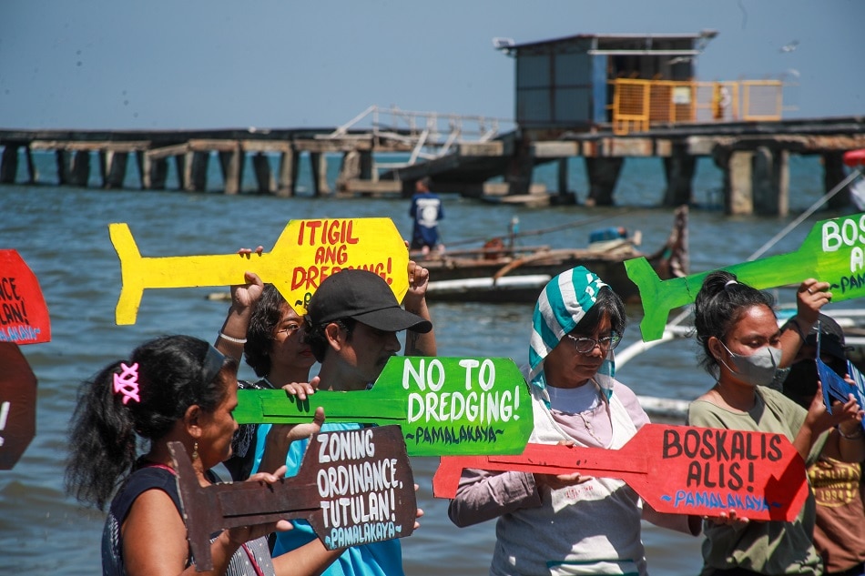 Members of Pambansang Lakas ng Kilusang Mamamalakaya ng Pilipinas (PAMALAKAYA) hold a fluvial protest along the coast of Rosario in Cavite, as they urge the government issue an order to halt the destructive dredging activities in the southern part of Manila Bay. Fisherfolks in Rosario, Tanza, and Noveleta expressed concern on the ongoing dredging operations citing their negative impact on their livelihood. Jonathan Cellona, ABS-CBN News/file
