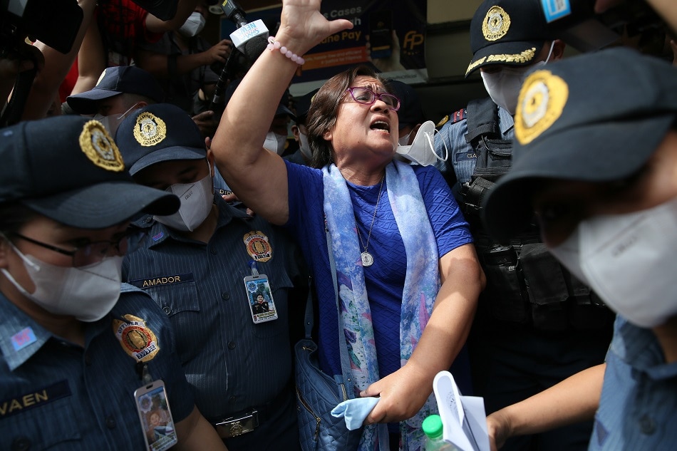 Former Senator Leila DeLima emerges from the Muntinlupa Regional Trial Court escorted by heavy security on May 12, 2023 after the court acquitted her of charges of illegal drug trading. Jonathan Cellona, ABS-CBN News/File