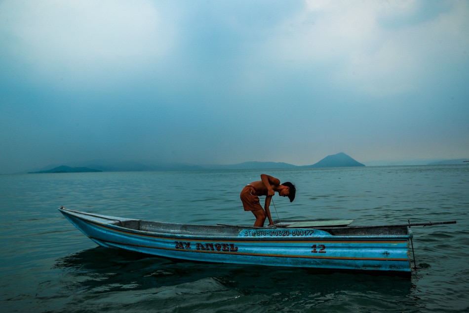 A fisherman continues fishing in Laurel, Batangas on Wednesday even as Taal Volcano releases volcanic smog due to increased activity. Jonathan Cellona, ABS-CBN News