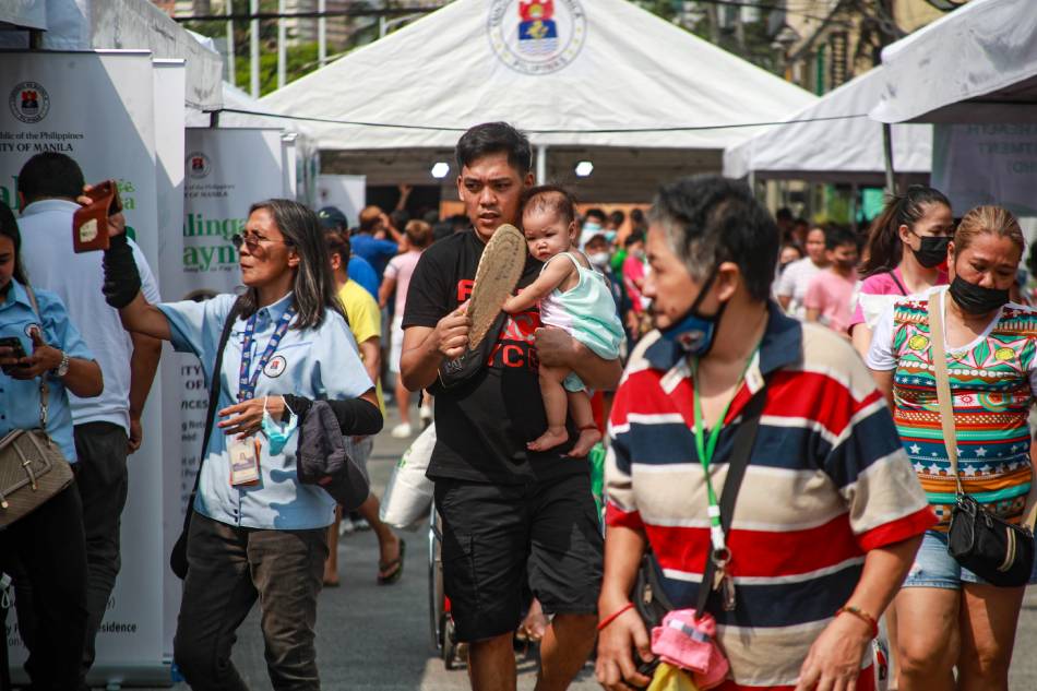 Residents brave the heat as they avail of free social services during an event organized by the City of Manila at De Pinedo Street in San Andres, Manila on April 24, 2023. Jonathan Cellona, ABS-CBN News