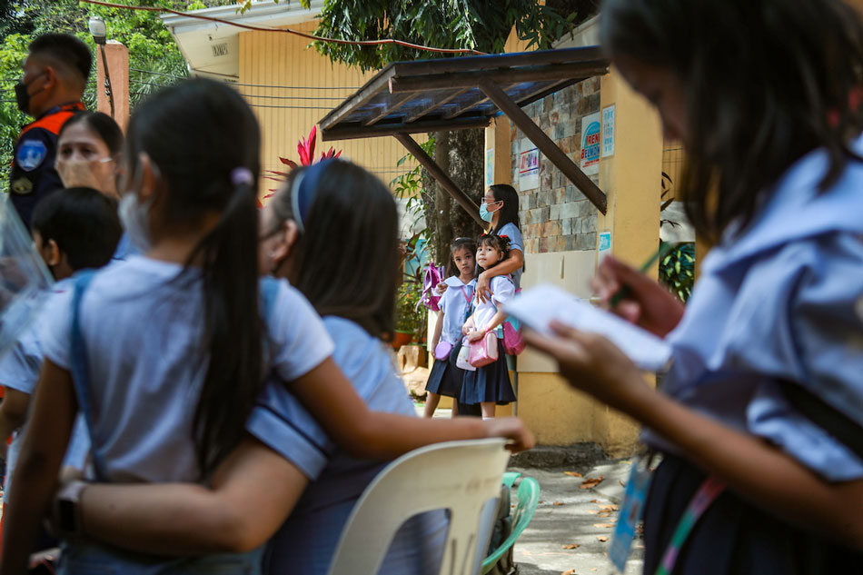 Teachers assist students as they evacuate the Ponciano Bernardo Elementary School in Quezon City last January 26, 2023. Jonathan Cellona, ABS-CBN News/file
