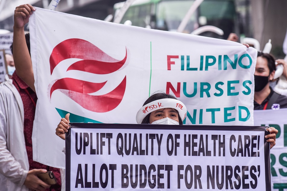 Members of the Filipino Nurses United (FNU) parade along Padre Faura to the Philippine General Hospital in Manila on Wednesday, April 12, 2023, for its 3rd National Congress with the theme 