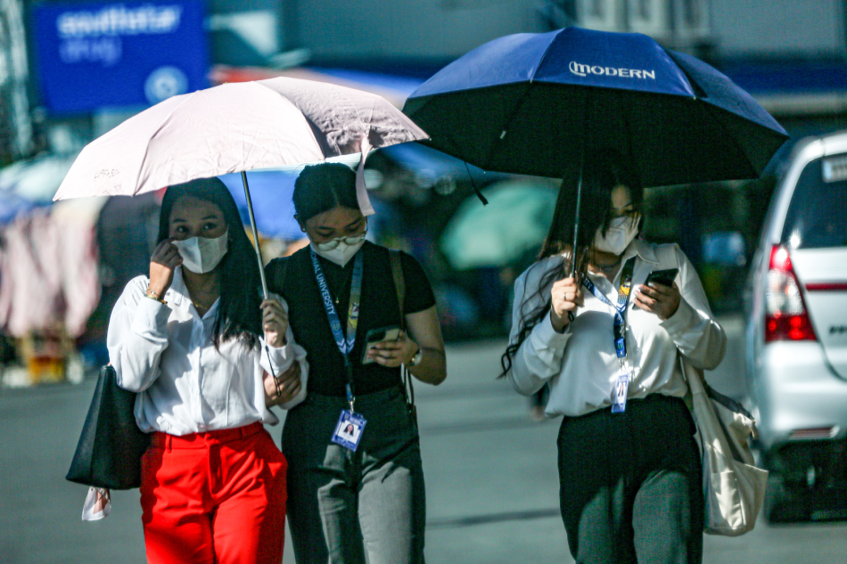 People use their mobile phones at a mall in San Juan City. Jonathan Cellona, ABS-CBN News/file