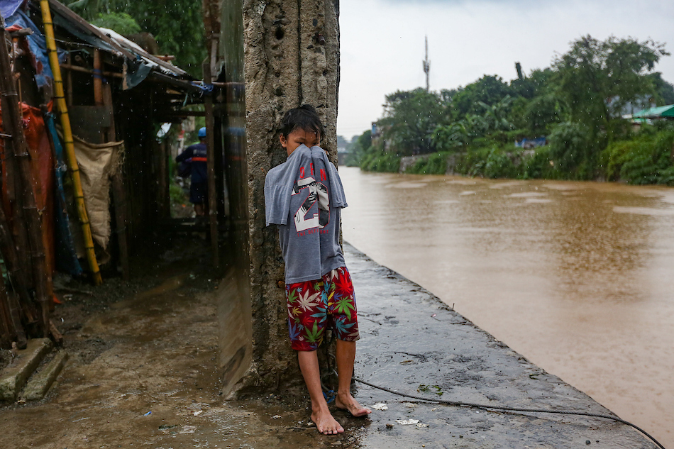 Residents stay on the lookout as rain continues to pour in San Mateo, Rizal on July 24, 2021. George Calvelo, ABS-CBN News/File