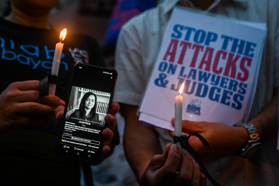  Human rights groups lead by the National Union of People’s Lawyers light candles at the Boy Scout Circle in Quezon City on Friday to protest the killing of lawyer Ma. Saniata Liwliwa Gonzalez Alzate. Maria Tan, ABS-CBN News