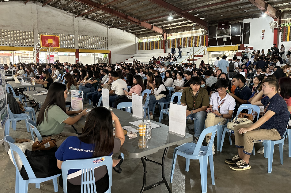 Prospective employees wait for screening during the recent “Sulong Buhay Job Fair” that First Philippine Industrial Park held in Santo Tomas City, Batangas, in coordination with the local government. More than 50 companies in Santo Tomas City, Batangas, including a dozen FPIP locators, posted over 4,000 job vacancies during the fair. Handout.