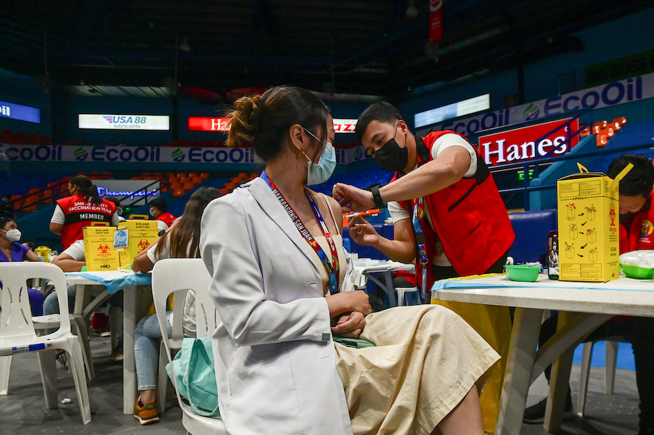 Healthcare workers from different health institutions in San Juan City receive the COVID-19 bivalent vaccine at the FilOil EcoOil Centre. The bivalent COVID-19 vaccine contains components that provide superior protection against both the original strain and the newer omicron variant to reduce the risk of serious diseases, hospitalization, and mortality caused by COVID-19. Maria Tan, ABS-CBN News/file