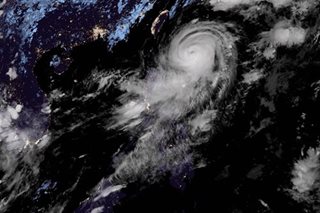Powerful Jenny maintains strength over Philippine Sea