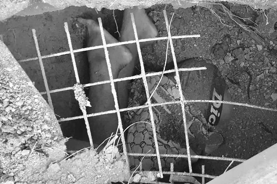 Body of victim John Mark Soriano in a septic tank in Peñablanca, Cagayan province. Photo courtesy of Peñablanca PNP